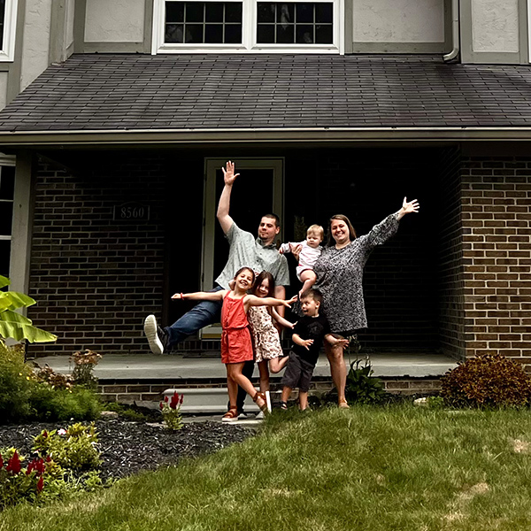 Family of six in front of their Columbus, Ohio home.